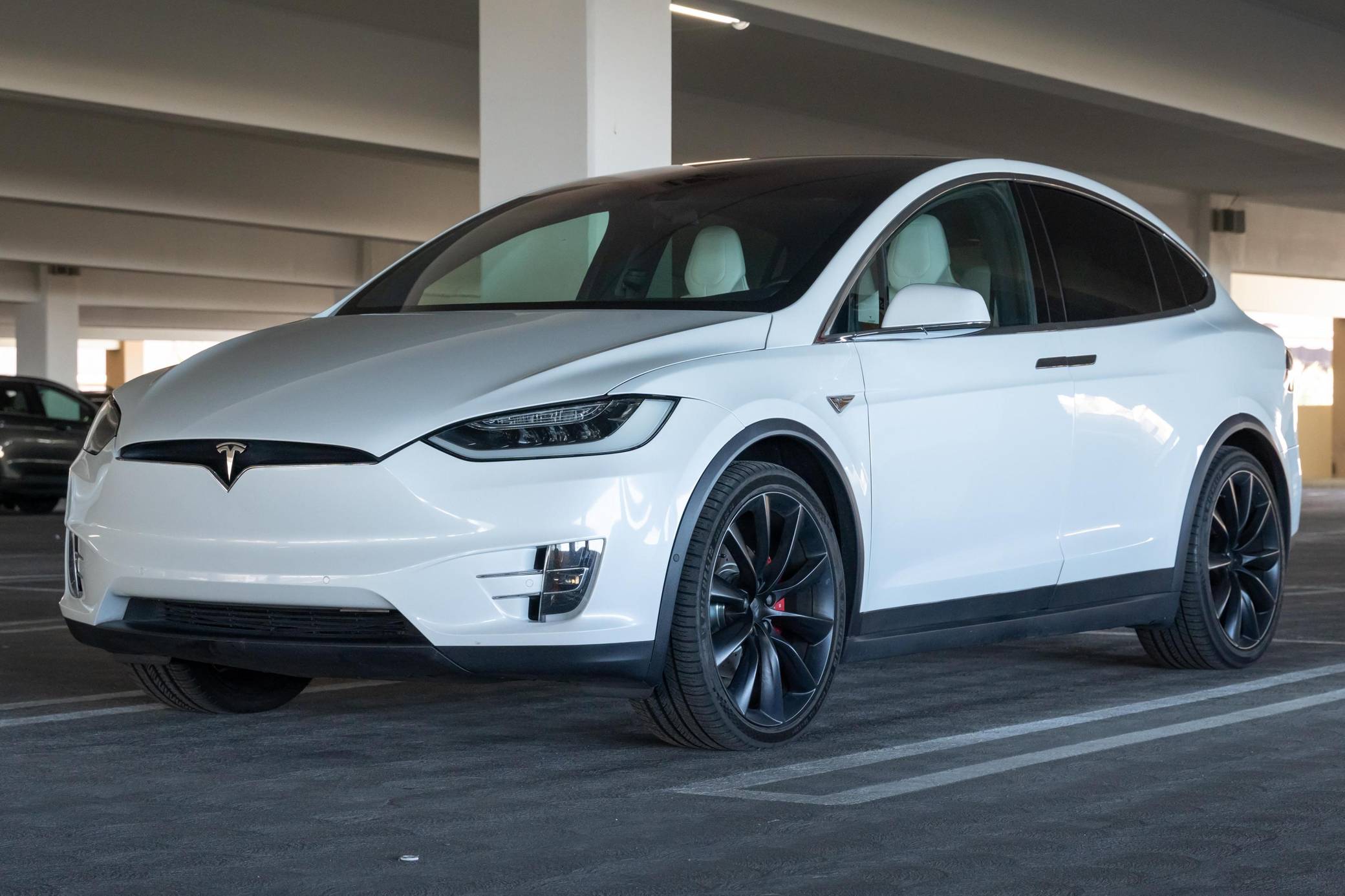 Tesla x p90d deals range